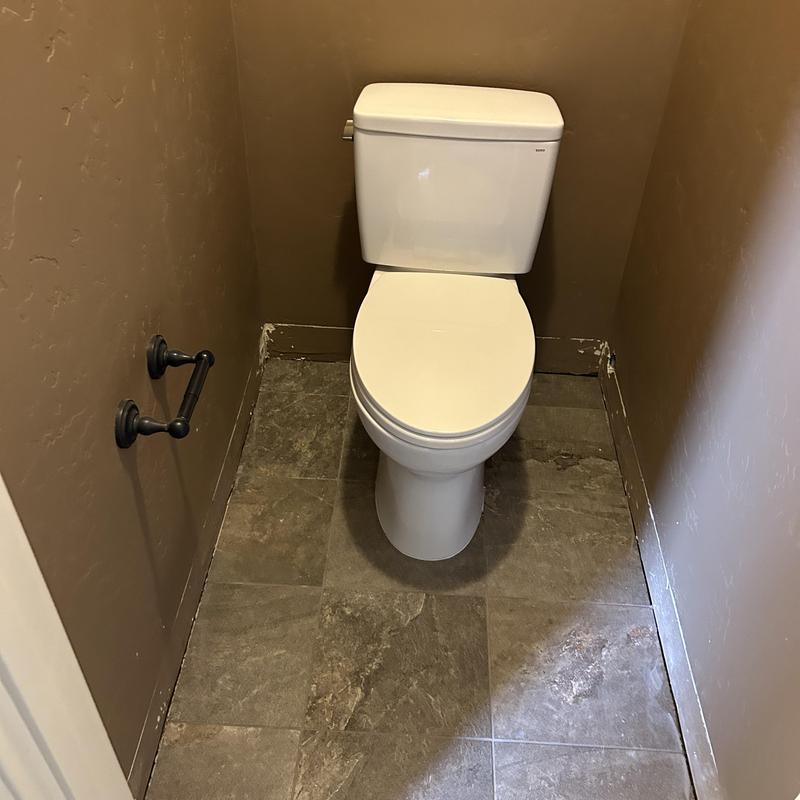 Toilet installation with new angle stop in bathroom Toilet installation with new angle stop in bathroom