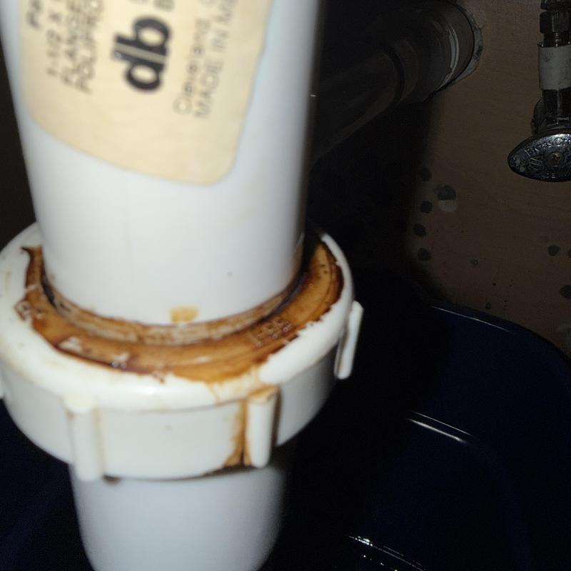 Bathroom faucet drain pipe with rust and leakage