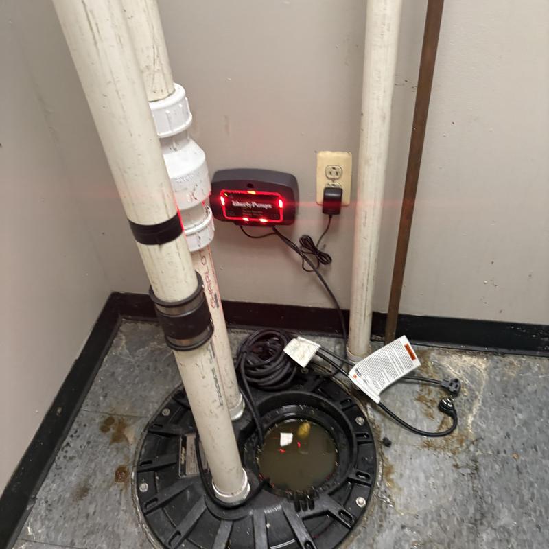 Sump pump system with discharge pipes and control panel Sump pump system with discharge pipes and control panel