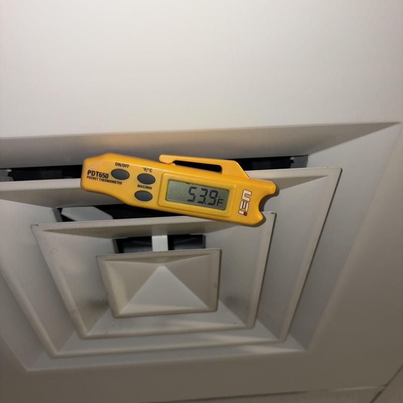 Heat pump vent with thermometer reading 53.9°F Heat pump vent with thermometer reading 53.9°F