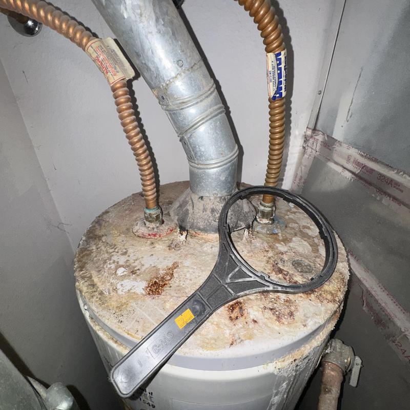 Gas water heater with corrosion and rust buildup Gas water heater with corrosion and rust buildup