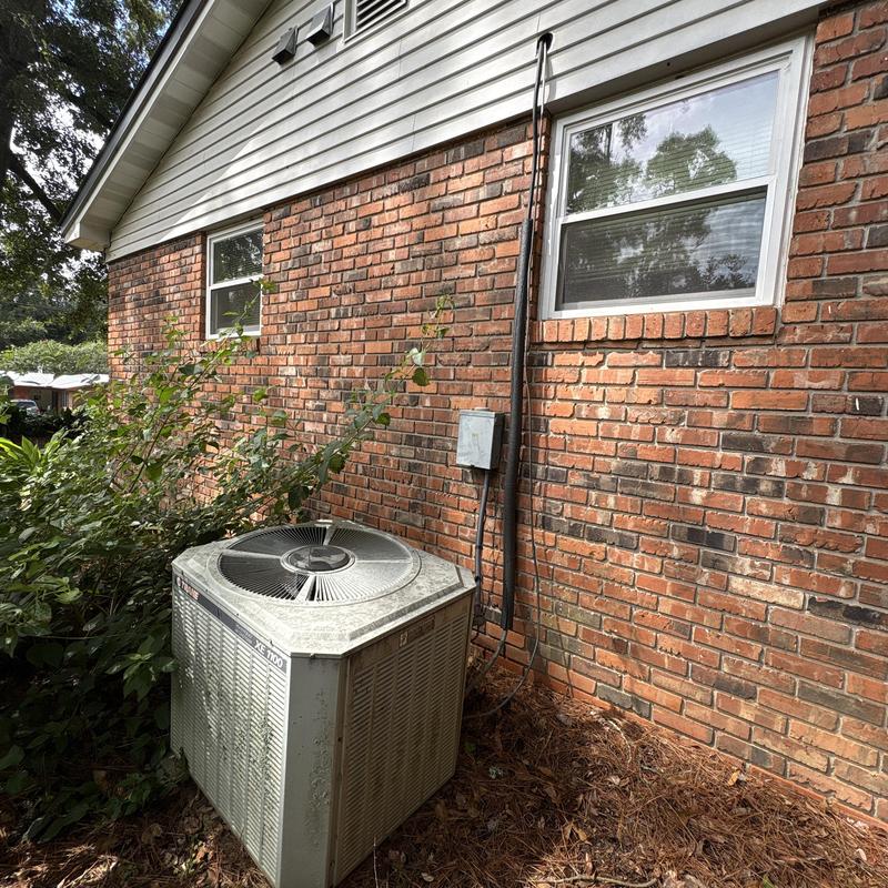 Air conditioner unit outside brick home in Tallahassee FL Air conditioner unit outside brick home in Tallahassee FL