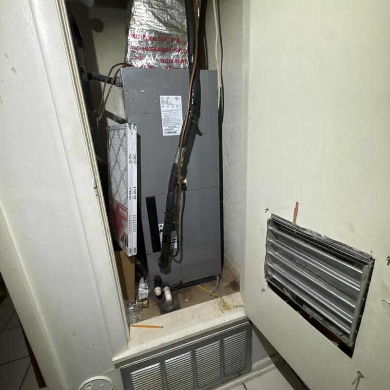 Furnace unit with ductwork access panel open Furnace unit with ductwork access panel open