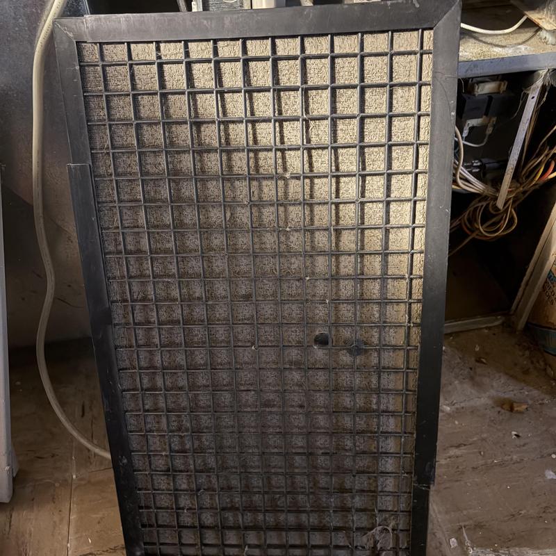 Air conditioner washable filter clogged with dust Air conditioner washable filter clogged with dust