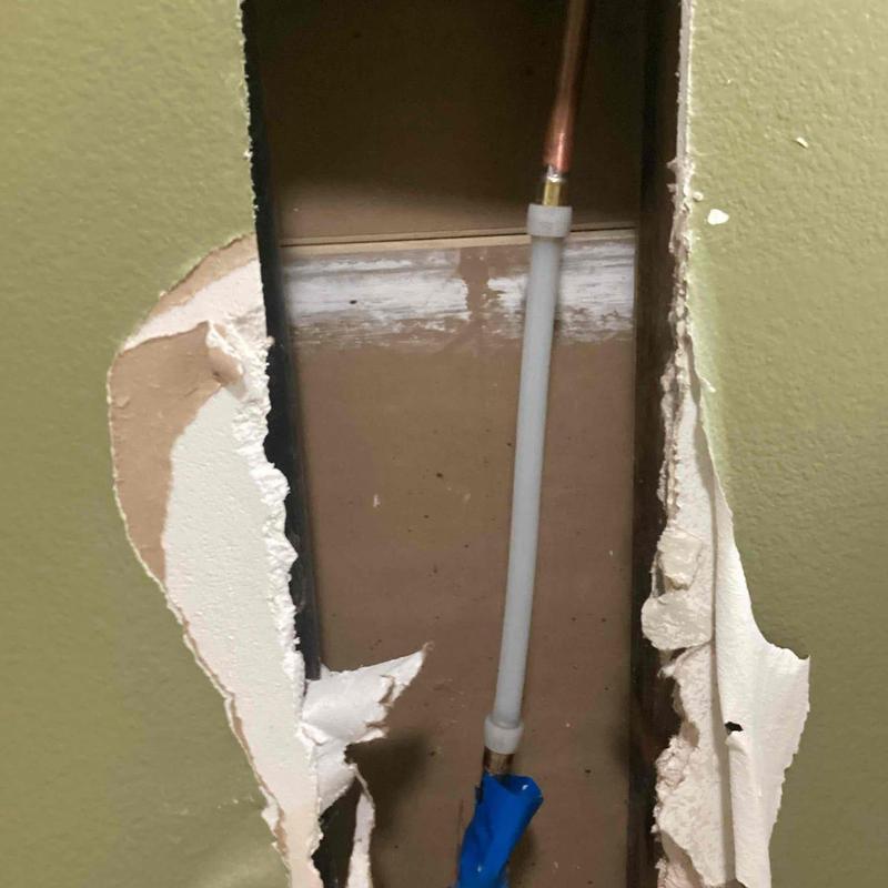 Half-inch waterline with PEX repair inside wall cavity Half-inch waterline with PEX repair inside wall cavity