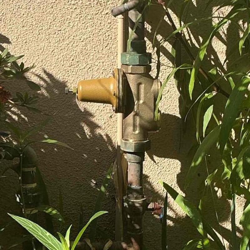 Double-check pressure regulator installed on pipe outdoors Double-check pressure regulator installed on pipe outdoors