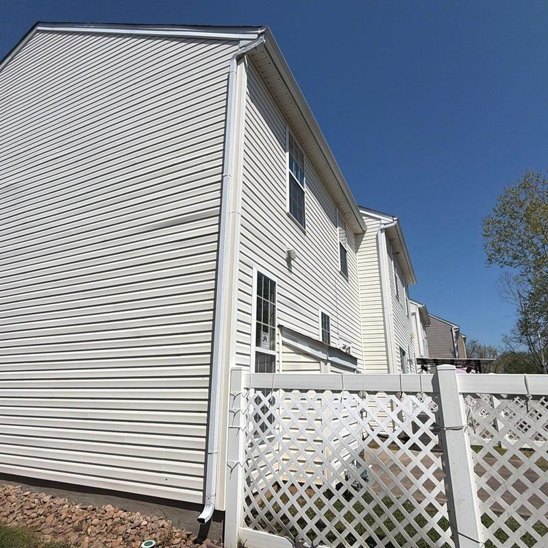 Vinyl siding and gutter system on residential building
