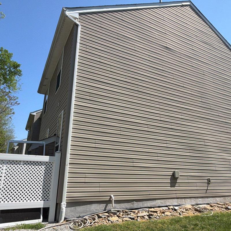 Vinyl siding inspection showing weather impact and damage