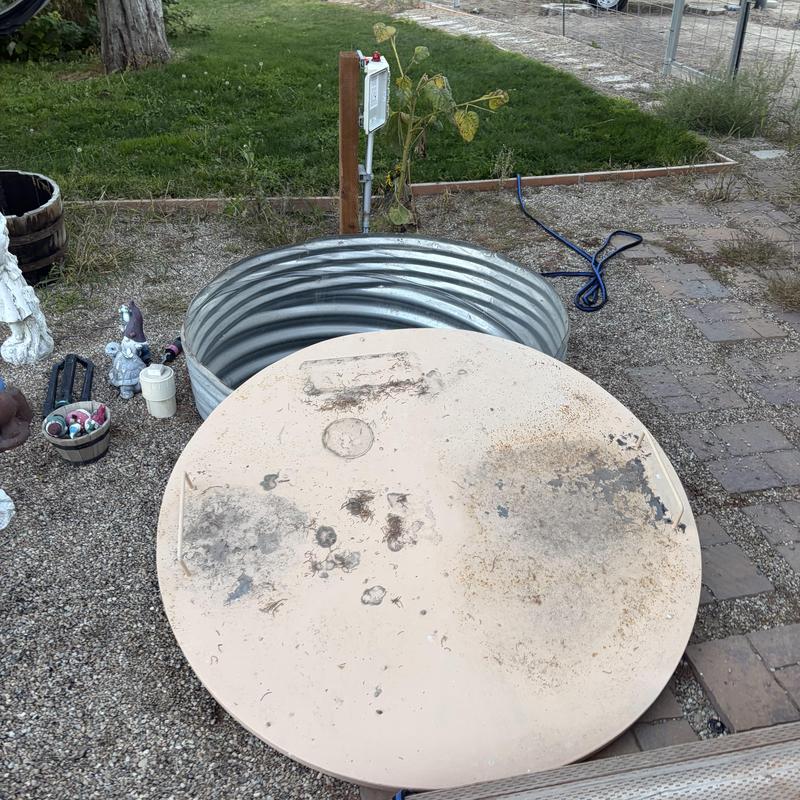 Sewage ejector pump basin with open lid outdoors