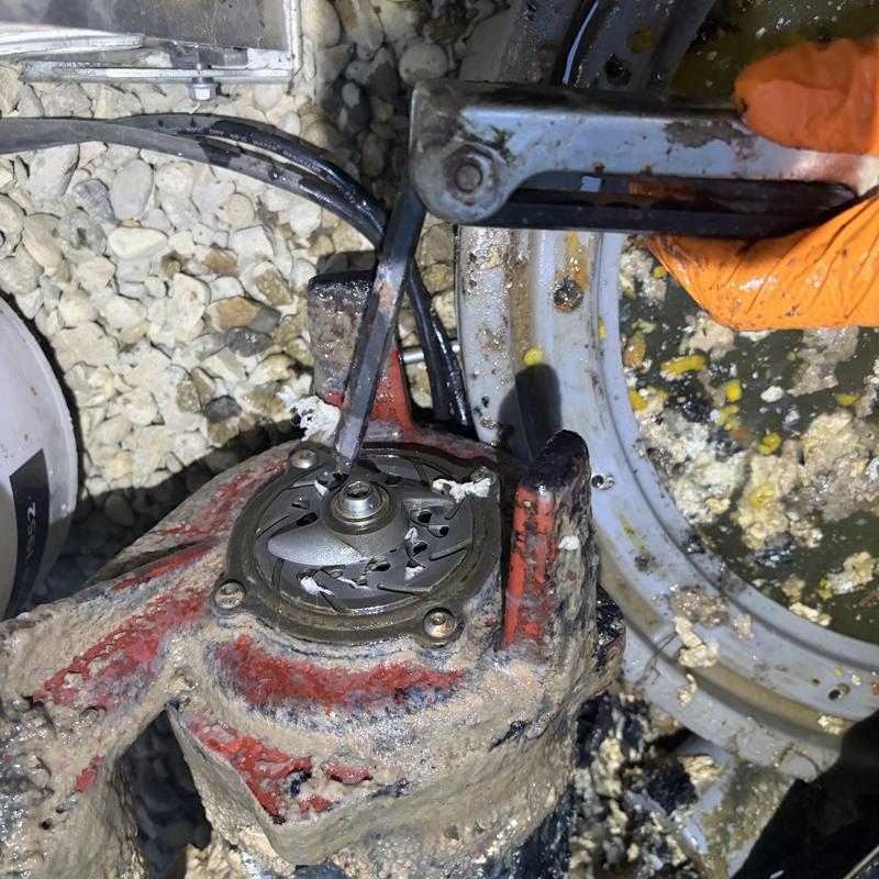 Grinder pump impeller cleared of wipes in septic basin