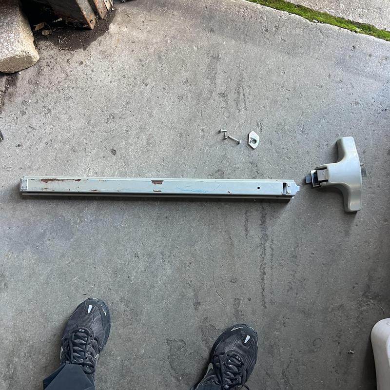 Exit device and push bar removed from door on floor Exit device and push bar removed from door on floor