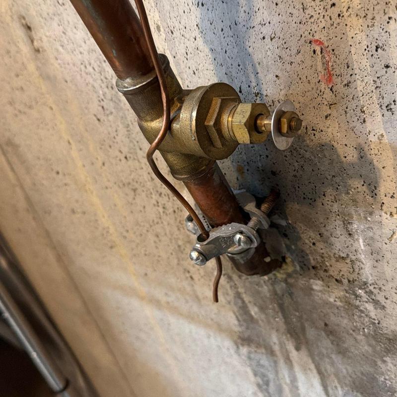 Pressure reducing valve on copper pipe with mounting clamp