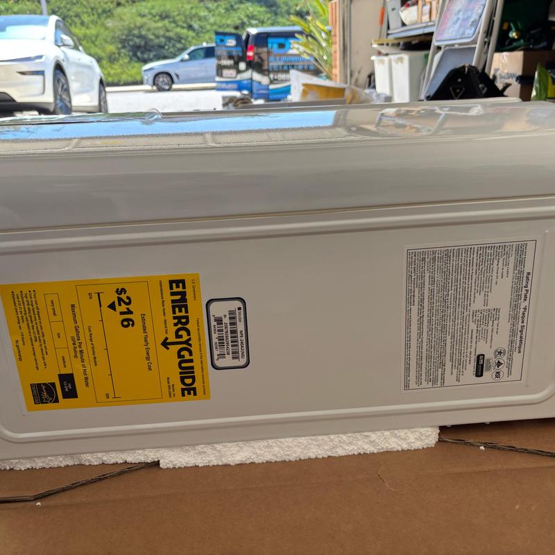 Tankless water heater side view with energy label Tankless water heater side view with energy label