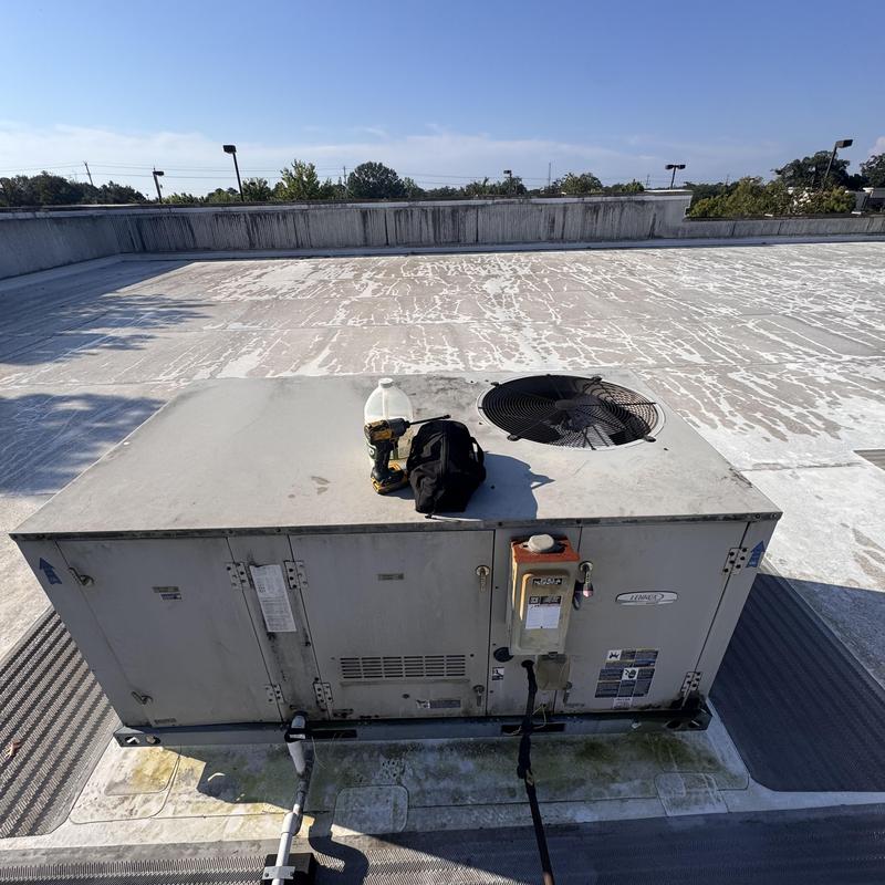 Rooftop unit (RTU) with tools on flat roof Rooftop unit (RTU) with tools on flat roof