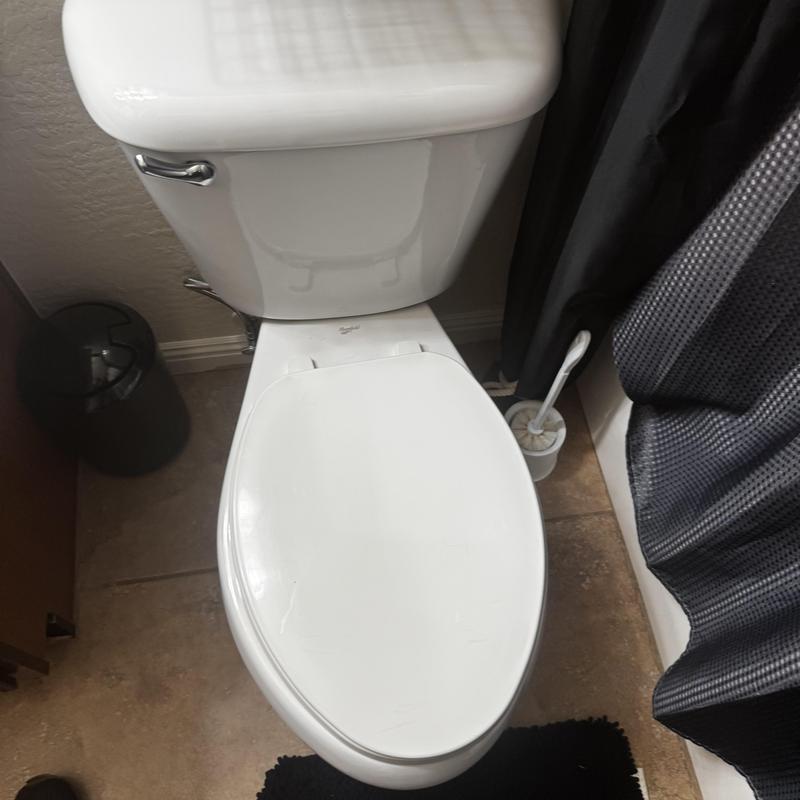 Toilet with new wax ring seal installed in bathroom Toilet with new wax ring seal installed in bathroom