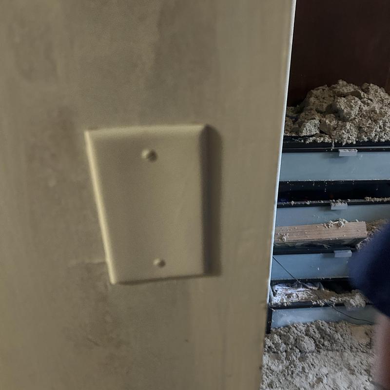Electrical switch plate cover on drywall near insulation ruin Electrical switch plate cover on drywall near insulation ruin