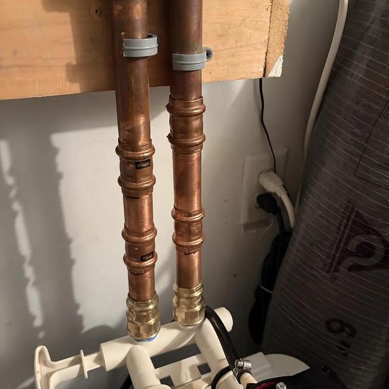 Copper water heater pipes with anode rod installation