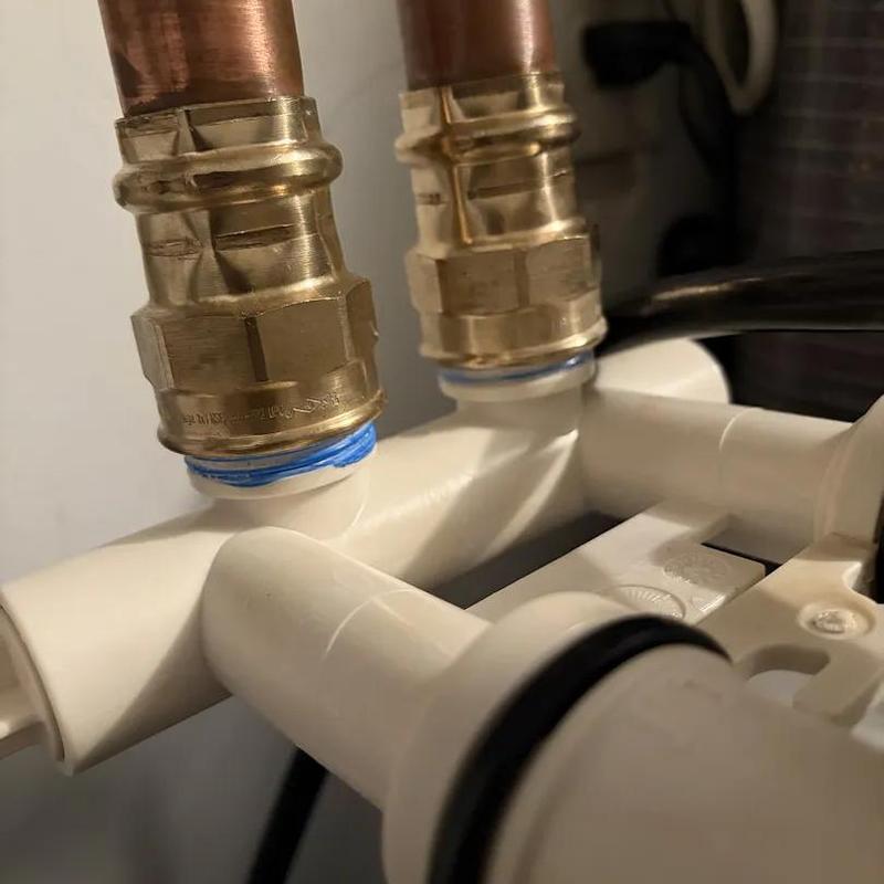 Copper pipe connections on water heater assembly