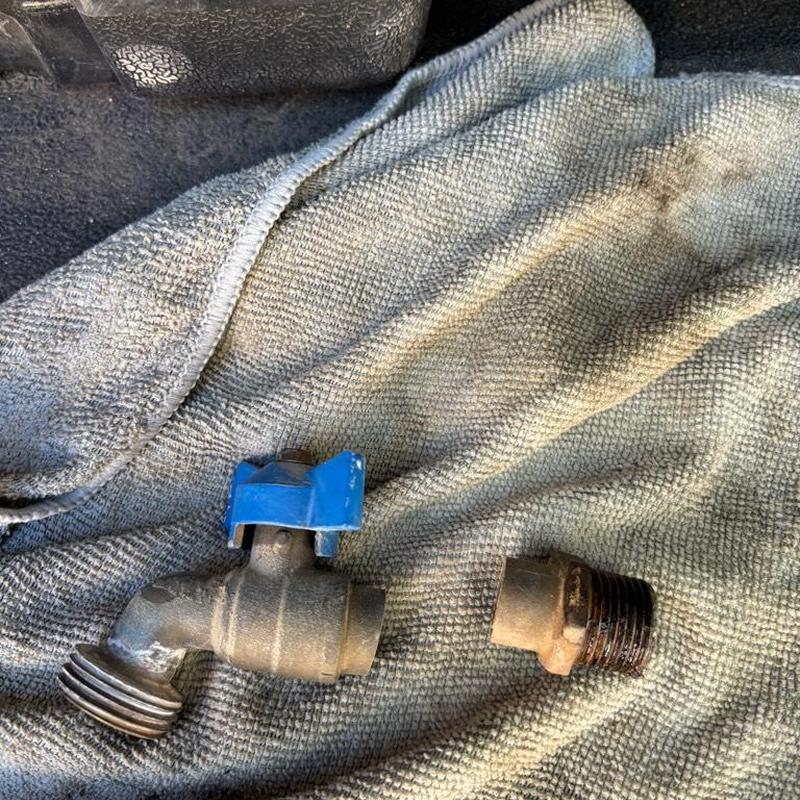 Hose bib valve and pipe fitting on towel