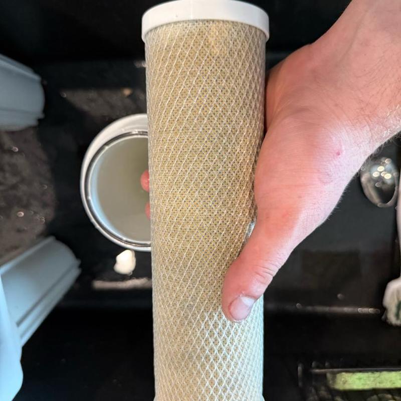 RO water filter cartridge replacement in hand