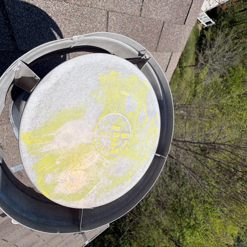 Roof exhaust vent on asphalt shingle roof
