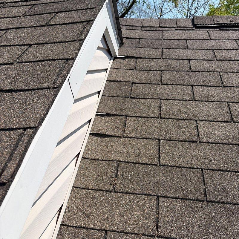 Asphalt shingle roof with hail damage inspection