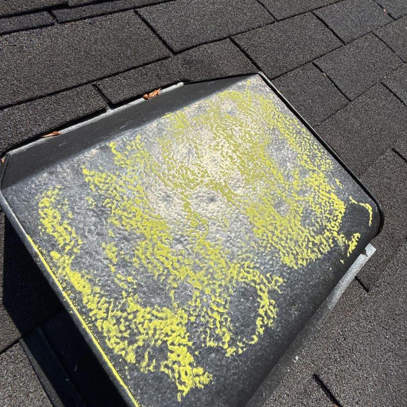 Roof vent with hail damage marked in yellow