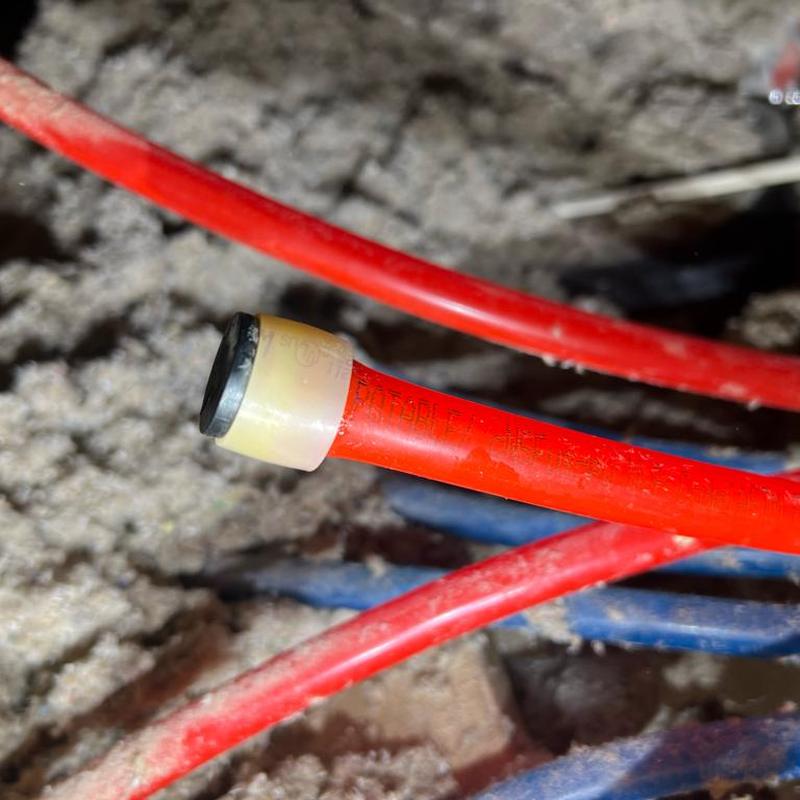 PEX water line with new ring and cap installed