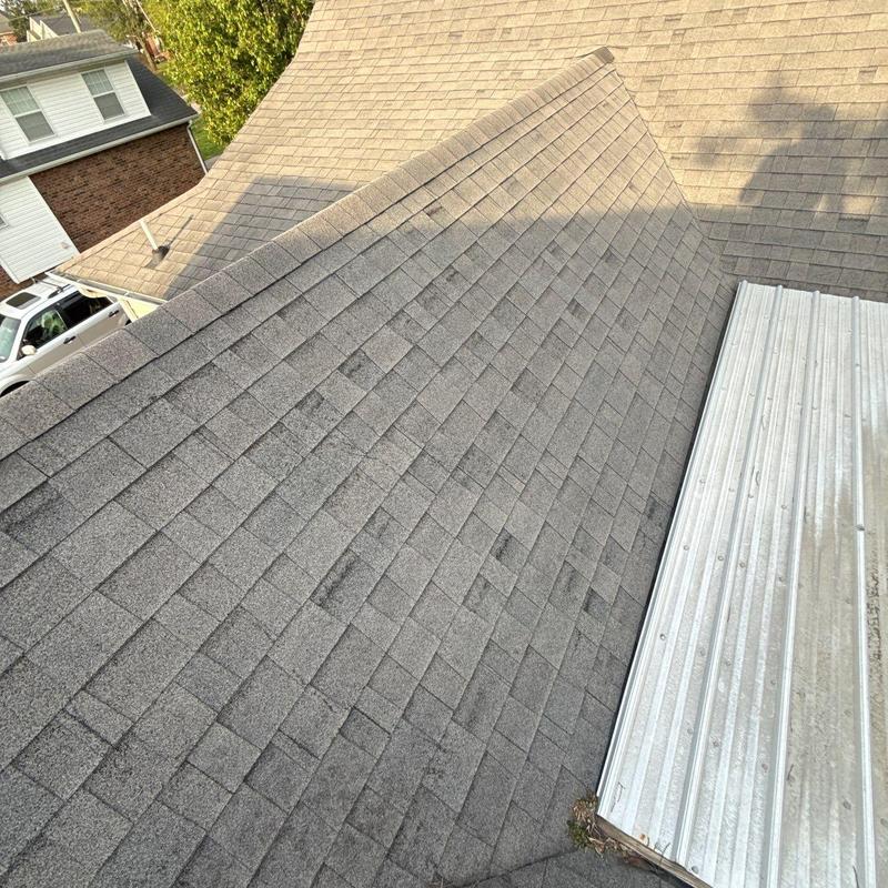 Asphalt shingles roof with visible hail damage spots