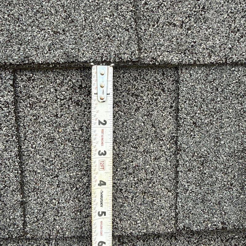 Asphalt shingles with hail damage measurement
