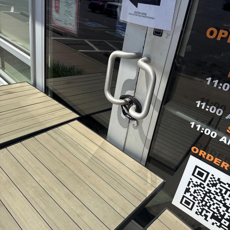 Door handle with lock securing entrance door