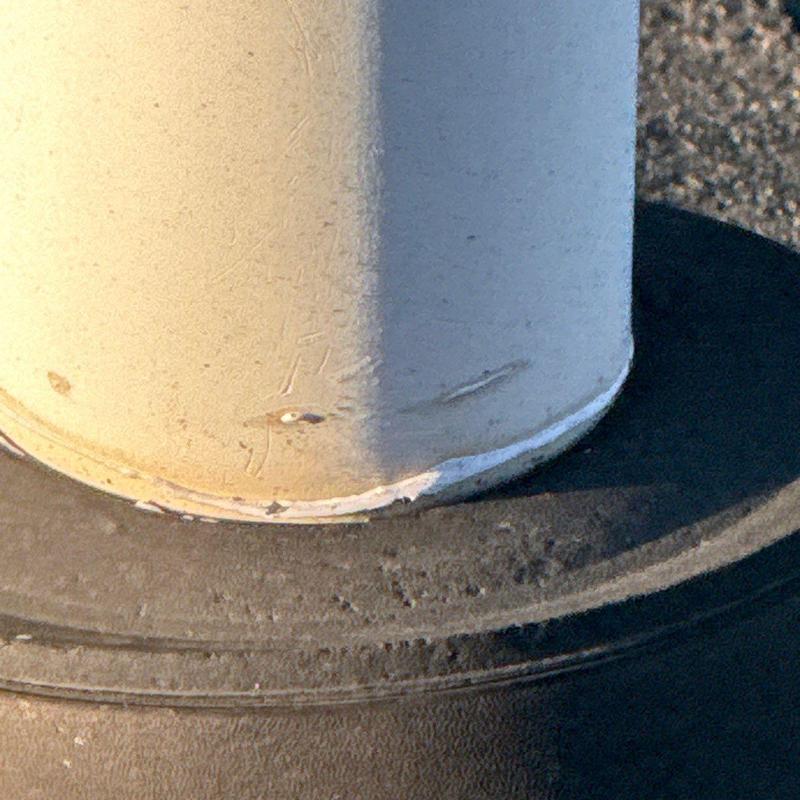 Roof pipe flashing with edge damage close-up