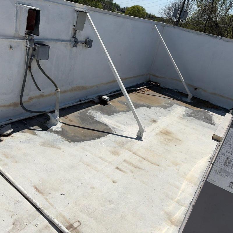 Flat roof membrane with weathering and patch repairs