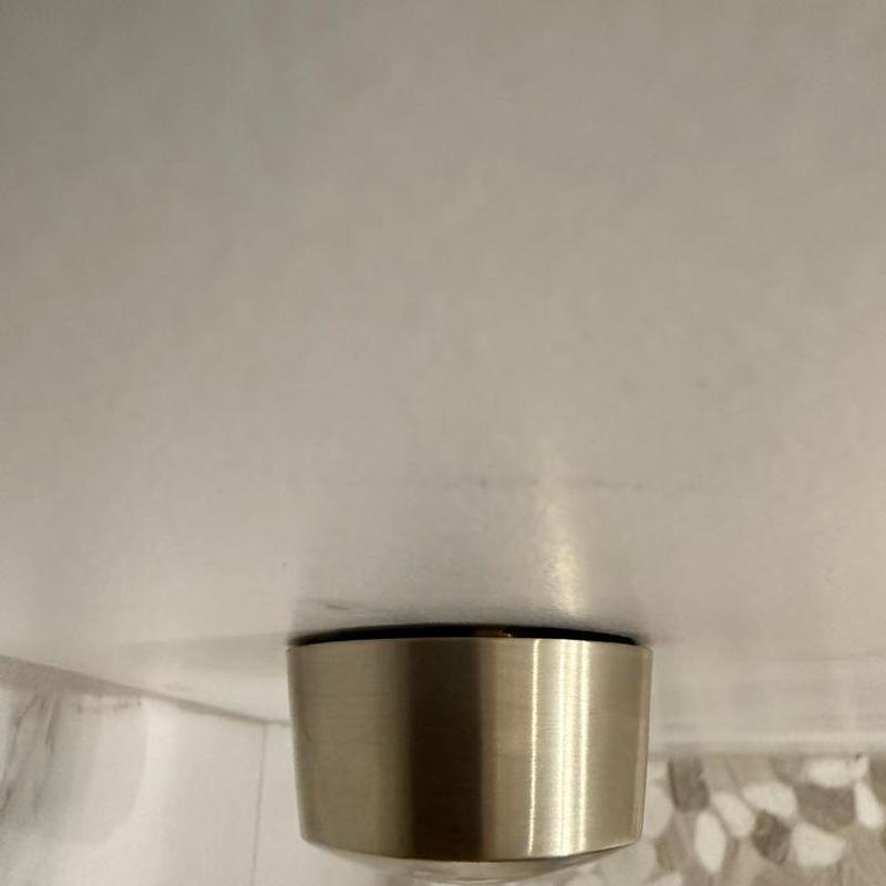 Shower drain relocated with new trim installed
