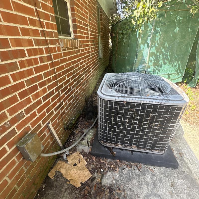Outdoor air conditioner condenser unit with protective cage Outdoor air conditioner condenser unit with protective cage