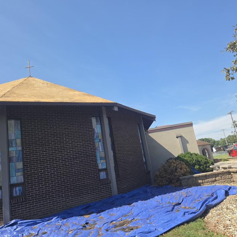 Metal roof decking installation on church roof