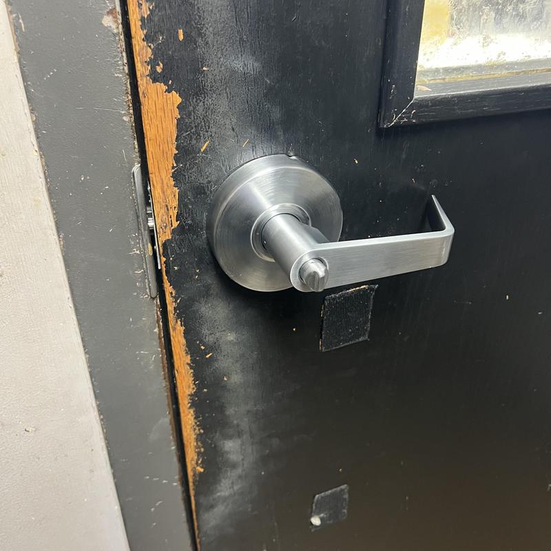 Entrance door lever handle on black door Entrance door lever handle on black door