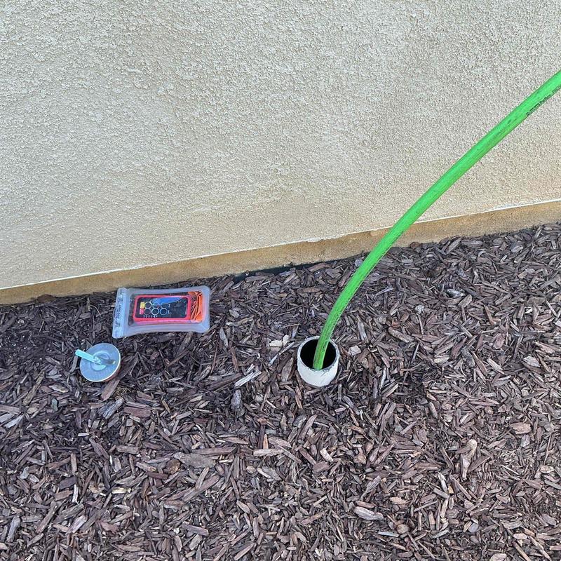 Drain system hydro-jetting hose inserted in ground pipe Drain system hydro-jetting hose inserted in ground pipe