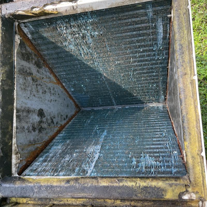 Evaporator coil of split heat pump inside housing Evaporator coil of split heat pump inside housing