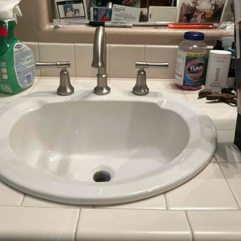 Widespread bathroom faucet with pop-up drain assembly Widespread bathroom faucet with pop-up drain assembly