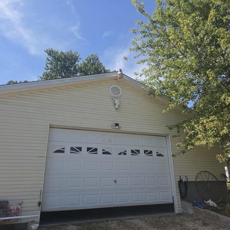Garage door and siding inspection at residential property