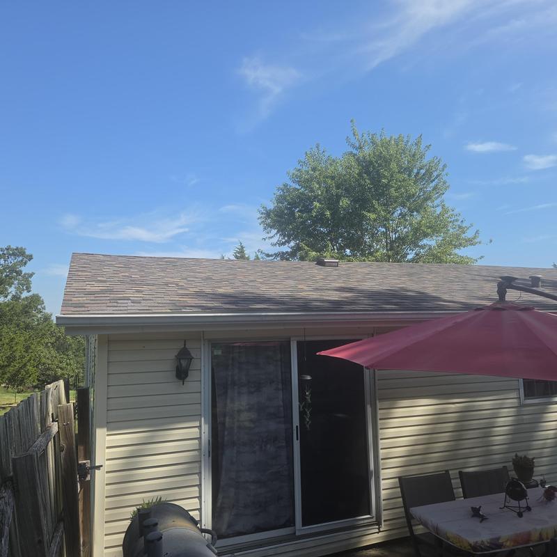 Owen's Corning shingle roof with patio umbrella nearby