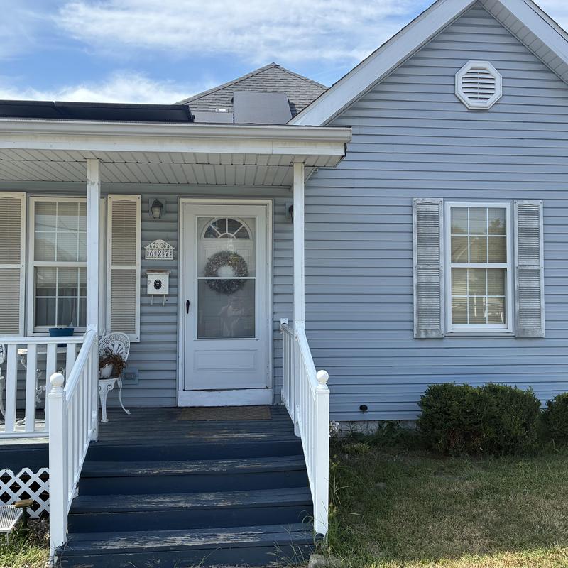 Roof shingles and porch railing of residential house