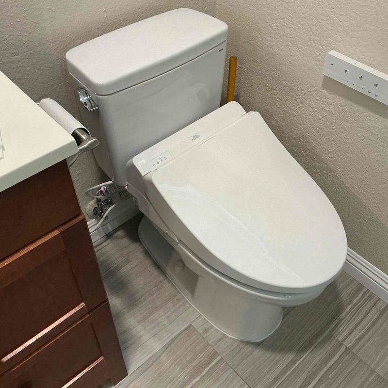 Toilet with electronic bidet seat installation Toilet with electronic bidet seat installation