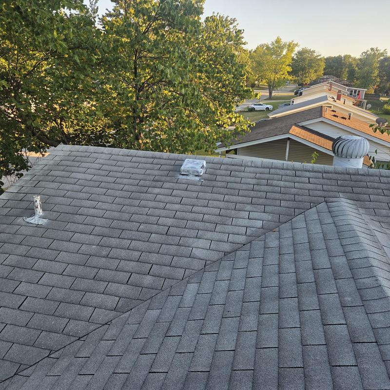 Asphalt shingle roof with vent and plumbing pipe