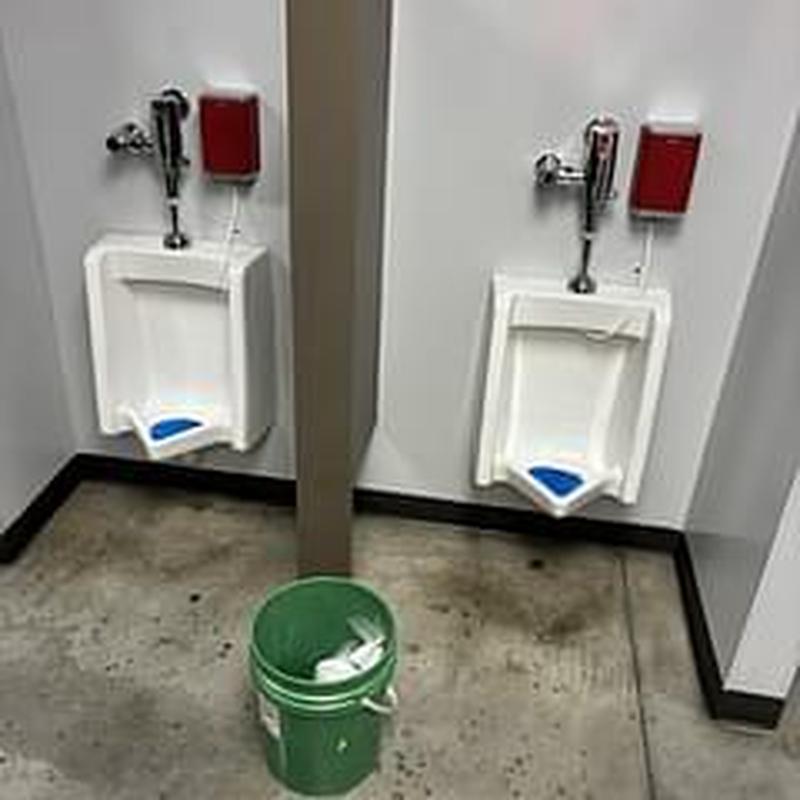 Urinal acid treatment with cleaning supplies bucket Urinal acid treatment with cleaning supplies bucket