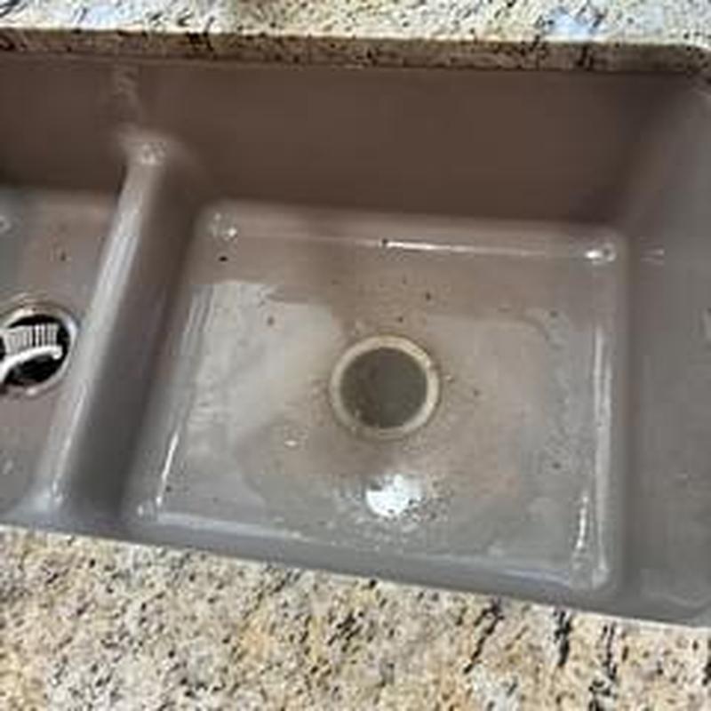 Kitchen sink drain with debris and residue buildup