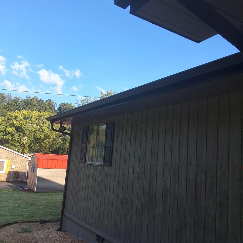 Gutter system on house exterior with clear sky Gutter system on house exterior with clear sky