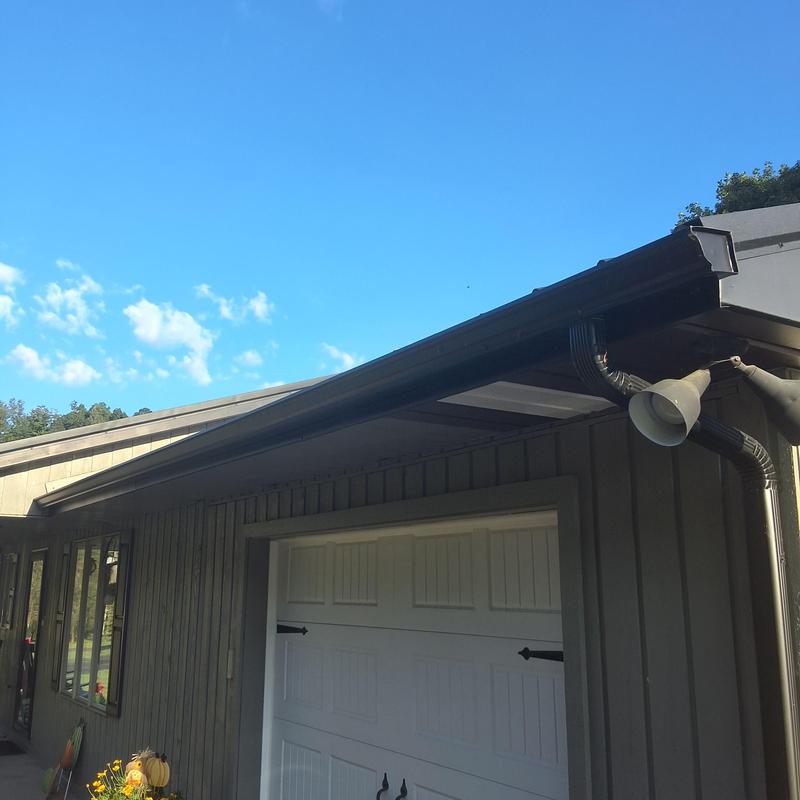 Gutter and downspout system on residential garage roof Gutter and downspout system on residential garage roof