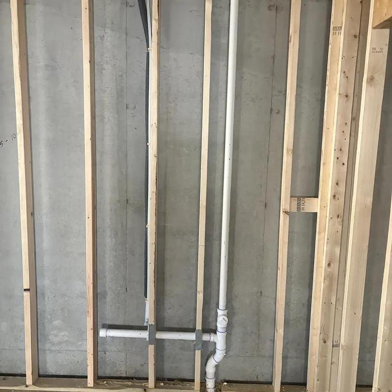 PVC plumbing pipes roughed in new home framing